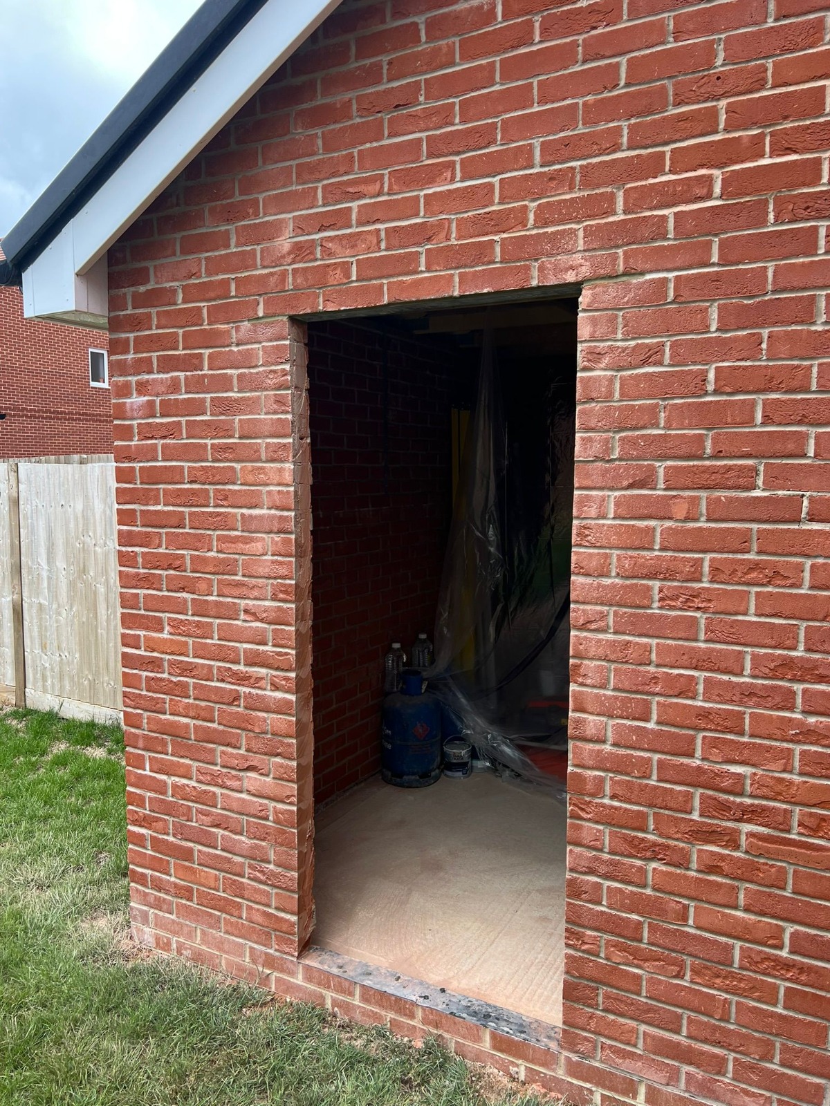 New brickwork around a garage opening on a house in Basingstoke